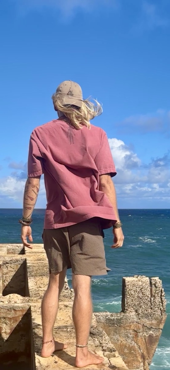 Alex at the ocean overlook, Kauai, HI — wearing the HI Classic Tee