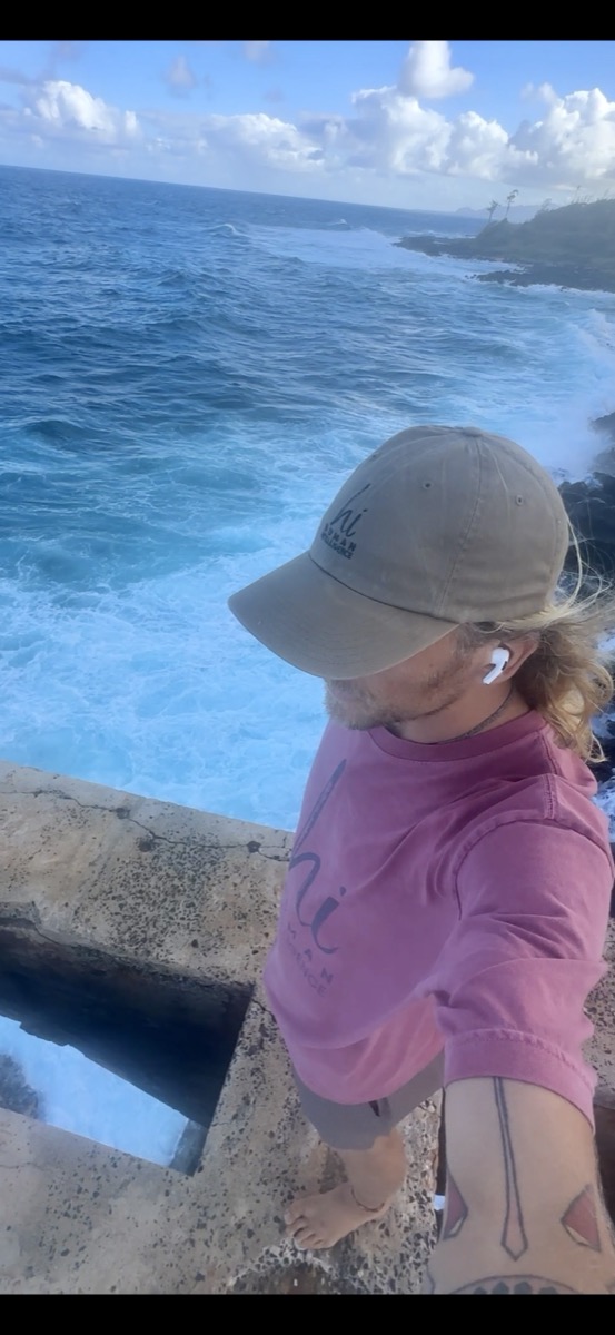 Alex wearing HI gear at the ocean overlook, Kauai, HI